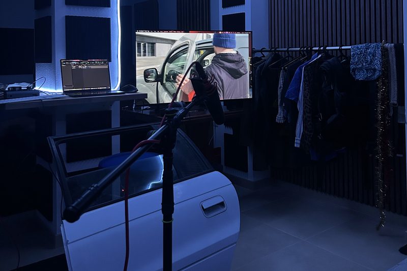 Car door set up for a Foley session in front of the screen and microphone